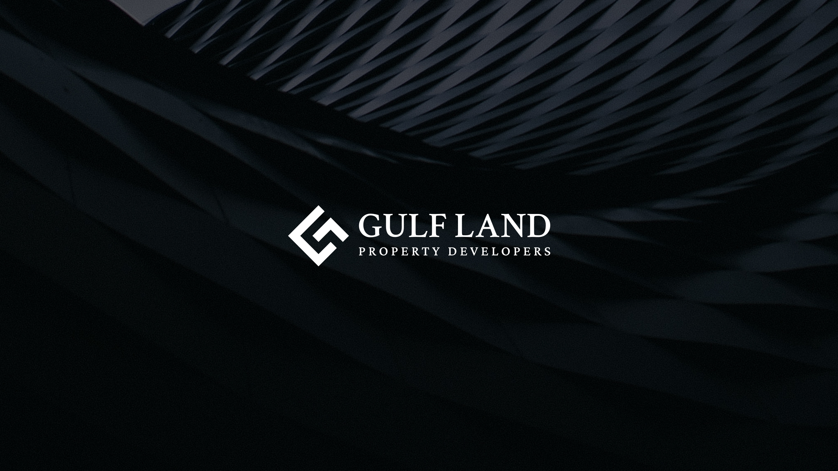 Gulf Land Property Developers identity on a dark architectural background